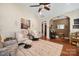 Cozy living room with high ceilings, a ceiling fan, hardwood floors, and comfortable seating arrangements at 512 Park View Dr, Belmont, NC 28012