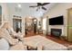 Spacious living room with a fireplace, hardwood floors, archways, and neutral colors at 512 Park View Dr, Belmont, NC 28012