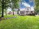 Sprawling backyard featuring lush grass, a patio and a well-manicured lawn at 5621 Landale Ct, Concord, NC 28027