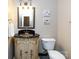 Powder room featuring decorative sink, vanity, and mirror at 5621 Landale Ct, Concord, NC 28027