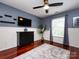 Comfortable bedroom with hardwood floors, a ceiling fan and natural light at 5621 Landale Ct, Concord, NC 28027