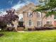Charming two-story brick home with a manicured lawn and beautiful landscaping at 5621 Landale Ct, Concord, NC 28027