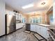 Open-concept kitchen with stainless steel appliances and granite countertops at 5621 Landale Ct, Concord, NC 28027