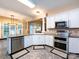 Spacious kitchen featuring granite countertops, stainless steel appliances, and a tiled floor at 5621 Landale Ct, Concord, NC 28027