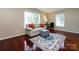Bright living room featuring hardwood floors, natural light and a comfortable seating area at 5621 Landale Ct, Concord, NC 28027