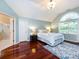 Charming bedroom with hardwood floors, a large window and an ensuite bathroom at 5621 Landale Ct, Concord, NC 28027