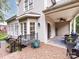Back patio featuring outdoor seating, brick pavers, and covered porch at 5621 Landale Ct, Concord, NC 28027