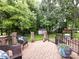 Inviting brick patio with seating and manicured greenery, creating a serene outdoor living space at 5621 Landale Ct, Concord, NC 28027