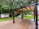Backyard patio featuring a pergola, outdoor grill and a storage shed at 5621 Landale Ct, Concord, NC 28027
