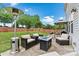 Relaxing outdoor patio featuring comfortable seating, a modern fire pit, and a well-maintained lawn at 575 Marthas View Nw Dr, Huntersville, NC 28078