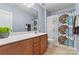 Bathroom featuring a spacious vanity with drawers, sink, mirror, and a floral shower curtain at 575 Marthas View Nw Dr, Huntersville, NC 28078