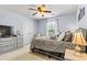 Bedroom with light gray walls, a queen bed, and white trim at 575 Marthas View Nw Dr, Huntersville, NC 28078