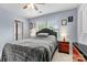 Cozy bedroom featuring a comfortable bed, natural light, and neutral decor at 575 Marthas View Nw Dr, Huntersville, NC 28078