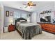 Bedroom with gray bedding, side tables with lamps, and a dresser at 575 Marthas View Nw Dr, Huntersville, NC 28078