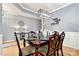 Elegant dining room with wainscoting, decorative lighting, and a sideboard is great for formal entertaining at 575 Marthas View Nw Dr, Huntersville, NC 28078