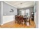 Formal dining room with wainscoting and traditional furnishings is an ideal space for gatherings at 575 Marthas View Nw Dr, Huntersville, NC 28078