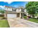 Beautiful two-story home with a brick-accented facade, attached garage, and meticulously maintained landscaping at 575 Marthas View Nw Dr, Huntersville, NC 28078