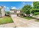 Attractive two-story home with an attached garage, manicured lawn, and inviting front entrance at 575 Marthas View Nw Dr, Huntersville, NC 28078