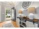 Charming foyer entrance with hardwood flooring, decorative accents, and a glimpse of the front yard at 575 Marthas View Nw Dr, Huntersville, NC 28078