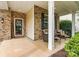 Welcoming front porch with seating, brick detailing, and an inviting entrance adorned with a 'Welcome' sign at 575 Marthas View Nw Dr, Huntersville, NC 28078