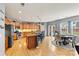 Spacious kitchen features an island with bar seating and a dining area with access to the backyard at 575 Marthas View Nw Dr, Huntersville, NC 28078