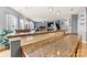 Granite countertops provide ample space in this kitchen that flows seamlessly into the living area at 575 Marthas View Nw Dr, Huntersville, NC 28078