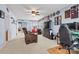 Spacious living room featuring a ceiling fan, comfortable seating, and a large television at 575 Marthas View Nw Dr, Huntersville, NC 28078