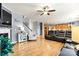 Open-concept living space with hardwood floors, a fireplace, and a view into the adjacent kitchen at 575 Marthas View Nw Dr, Huntersville, NC 28078