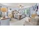 Spacious main bedroom with large bed, ceiling fan, and natural light from the window at 575 Marthas View Nw Dr, Huntersville, NC 28078