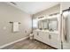 Modern bathroom with double sink vanity, decorative herringbone cabinets, and sleek black hardware at 5868 Savona Ter, Fort Mill, SC 29708
