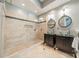 Luxurious bathroom featuring a glass-enclosed shower and dual vessel sinks at 5868 Savona Ter, Fort Mill, SC 29708