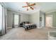 Bedroom featuring light gray walls, carpeted floors, a ceiling fan and natural light at 5868 Savona Ter, Fort Mill, SC 29708