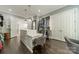 This walk-in closet provides tons of space, wood floors, hanging racks and a central island at 5868 Savona Ter, Fort Mill, SC 29708