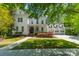 Charming two-story home features a landscaped yard, covered porch, and three car garage at 5868 Savona Ter, Fort Mill, SC 29708