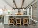 Modern kitchen with a large island, stainless steel appliances, and stylish pendant lighting at 5868 Savona Ter, Fort Mill, SC 29708