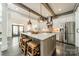 Bright kitchen with a large island, stainless appliances, and hardwood floors throughout at 5868 Savona Ter, Fort Mill, SC 29708
