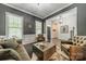 Living room featuring neutral decor, lots of natural light, and dark floors at 5868 Savona Ter, Fort Mill, SC 29708