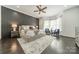 This main bedroom offers great natural light, a ceiling fan and hardwood flooring at 5868 Savona Ter, Fort Mill, SC 29708