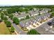Aerial view of modern townhomes, showcasing manicured landscaping and inviting curb appeal in a suburban neighborhood at 5908 Glassport Ln, Charlotte, NC 28210