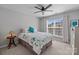 Cozy bedroom with a comfortable bed, side tables, and a large window for natural light at 5908 Glassport Ln, Charlotte, NC 28210