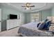 Beautiful bedroom with tray ceilings, plush bedding, and soft, calming decor and great natural light at 5908 Glassport Ln, Charlotte, NC 28210