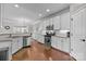 Well-appointed kitchen with sleek white cabinets, stainless steel appliances, and hardwood floors at 5908 Glassport Ln, Charlotte, NC 28210