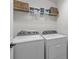 Modern laundry room equipped with a Whirlpool washer and dryer, and plenty of storage space at 5908 Glassport Ln, Charlotte, NC 28210