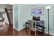 The office features hardwood floors, modern computer setup, and beach themed decor at 5908 Glassport Ln, Charlotte, NC 28210