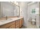 Bathroom with dual sinks, lots of cabinet space and an adjoining room at 6201 Creola Rd, Charlotte, NC 28270