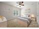 Neutral bedroom with a ceiling fan and sunny window at 6201 Creola Rd, Charlotte, NC 28270