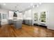 Bright and airy kitchen with stainless steel appliances, gray cabinets, and access to the outdoors, seamlessly blending indoor-outdoor living at 6201 Creola Rd, Charlotte, NC 28270