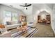 Bright living room with vaulted ceilings and skylights and a nearby office area at 6201 Creola Rd, Charlotte, NC 28270