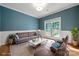 Comfortable living room with stylish decor, a patterned wall, and natural light, creating a cozy and inviting atmosphere at 6201 Creola Rd, Charlotte, NC 28270