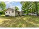 Exterior backyard with a white painted brick house and a small white van at 627 Gray Dr, Charlotte, NC 28213